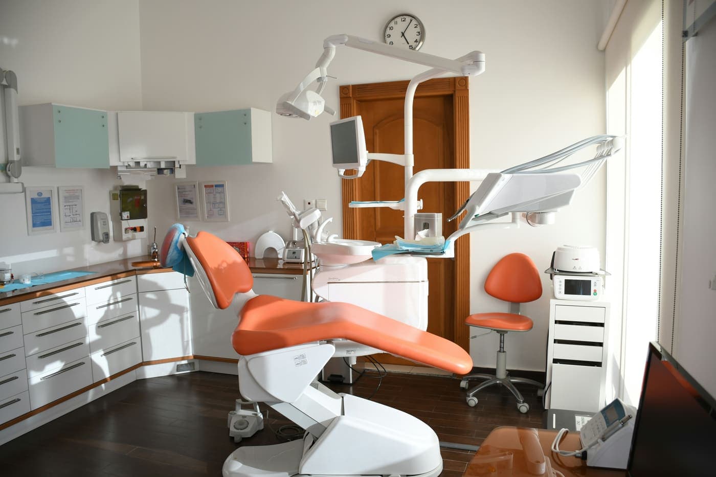 A treatment room at Irvington Family Dental with a window and plants